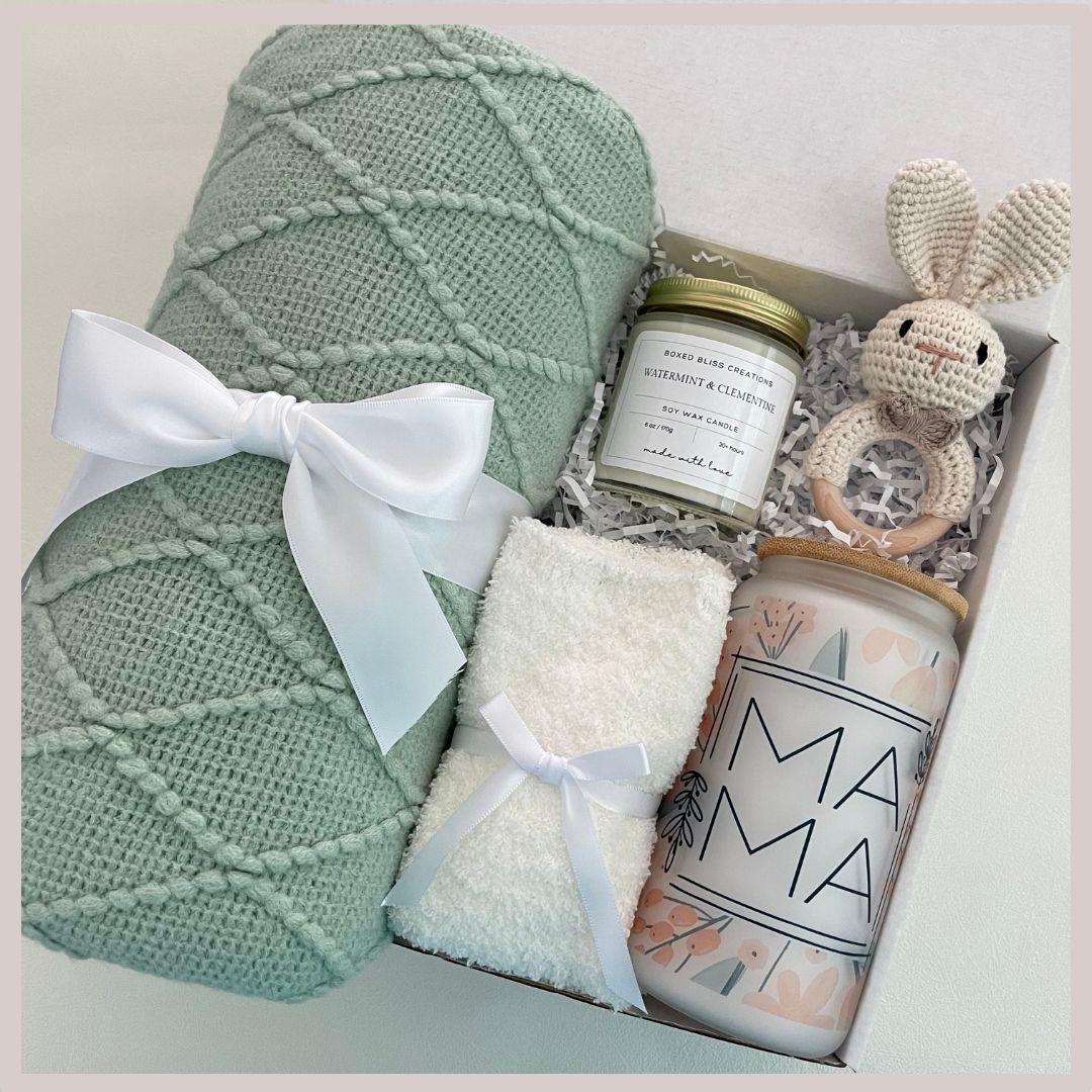 baby shower gift basket with blanket, baby rattle, soy wax candle, fuzzy socks, glass tumbler