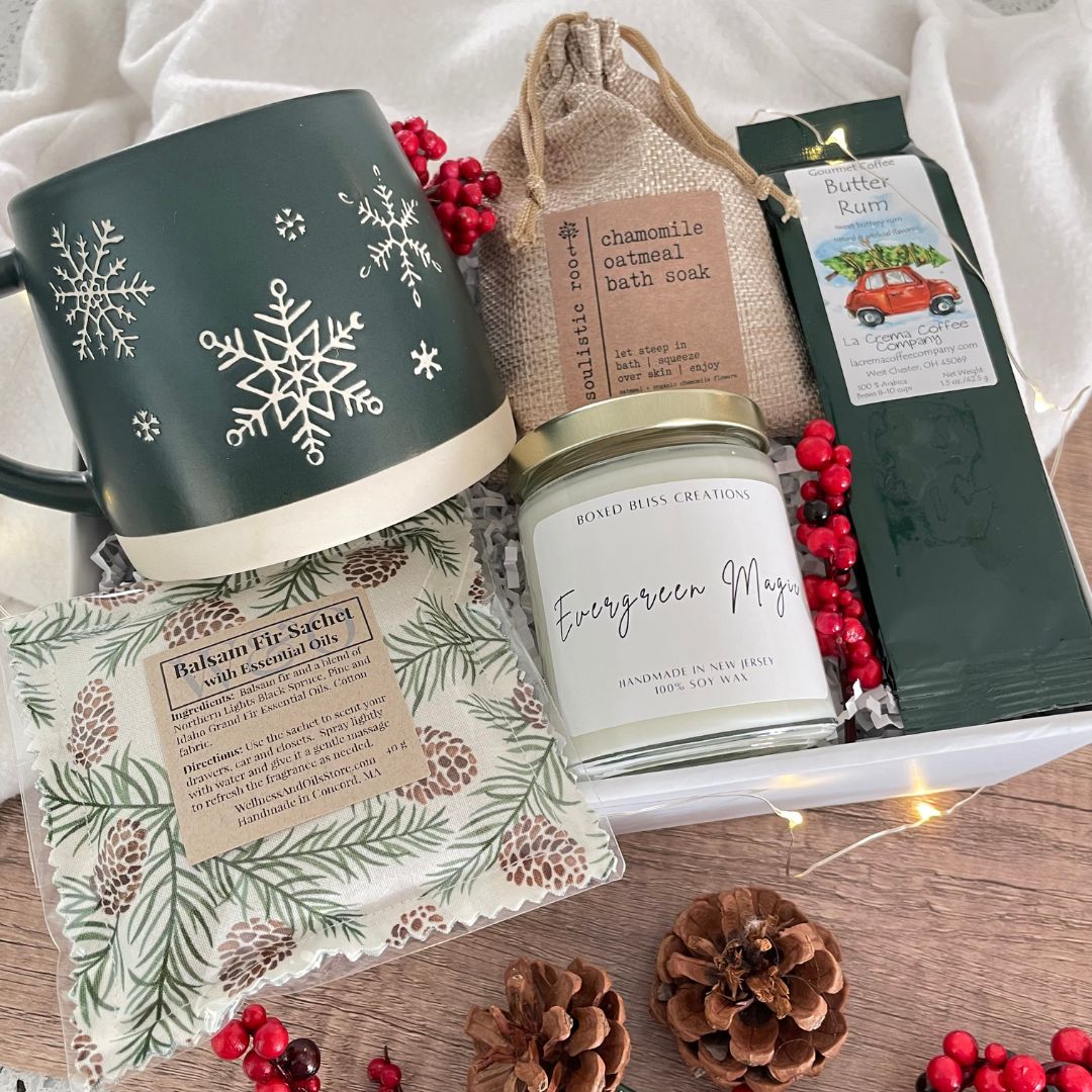 christmas gift set with green mug and evergreen candle